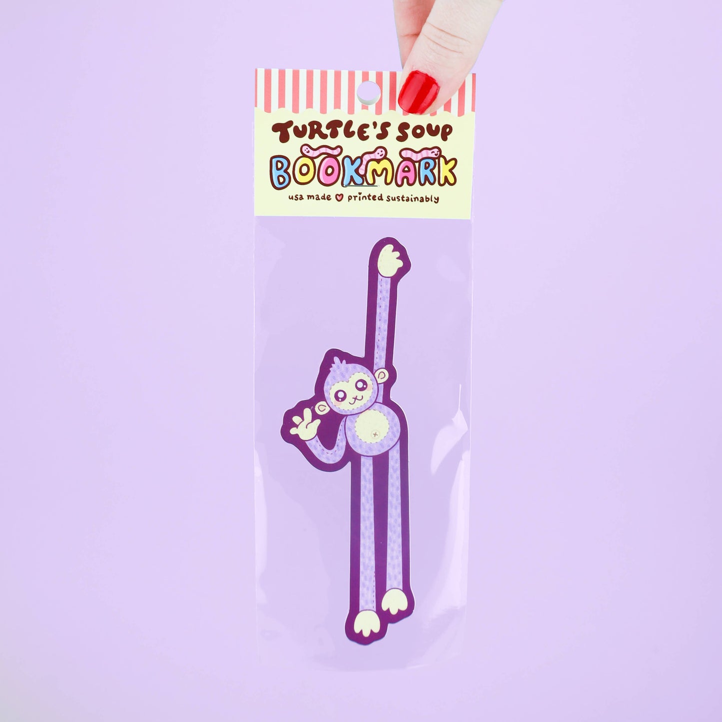Purple cartoon bookmark in packaging with 'Turtle's Soup' branding on a light purple background
