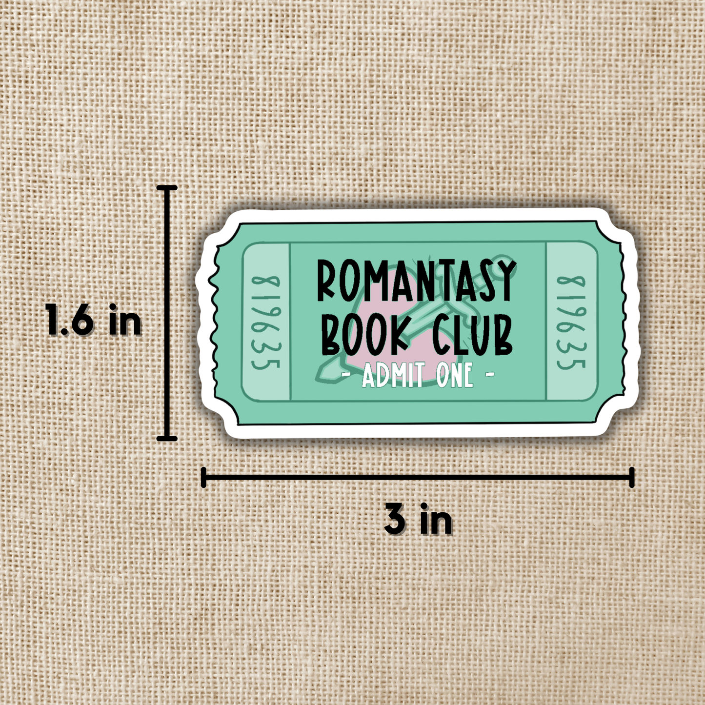 Sticker resembling a movie ticket with 'ROMANTASY BOOK CLUB' text on a beige fabric background