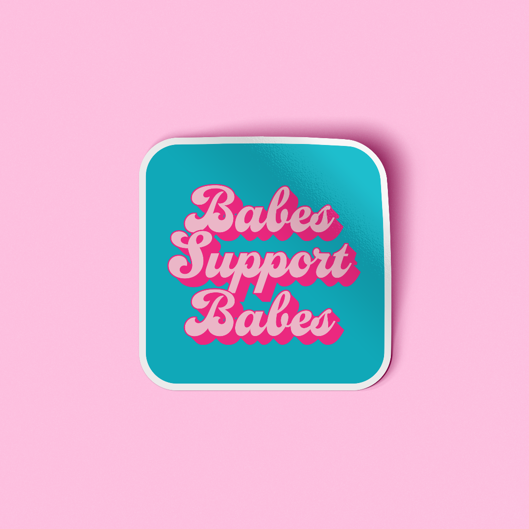 Sticker with 'Babes Support Babes' text on a pink background