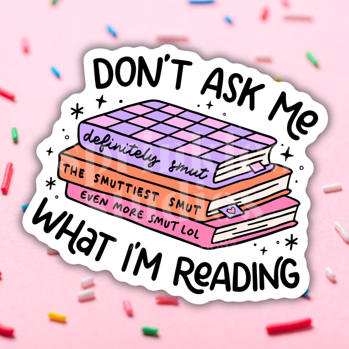 Sticker with books and text on a pink background with sprinkles