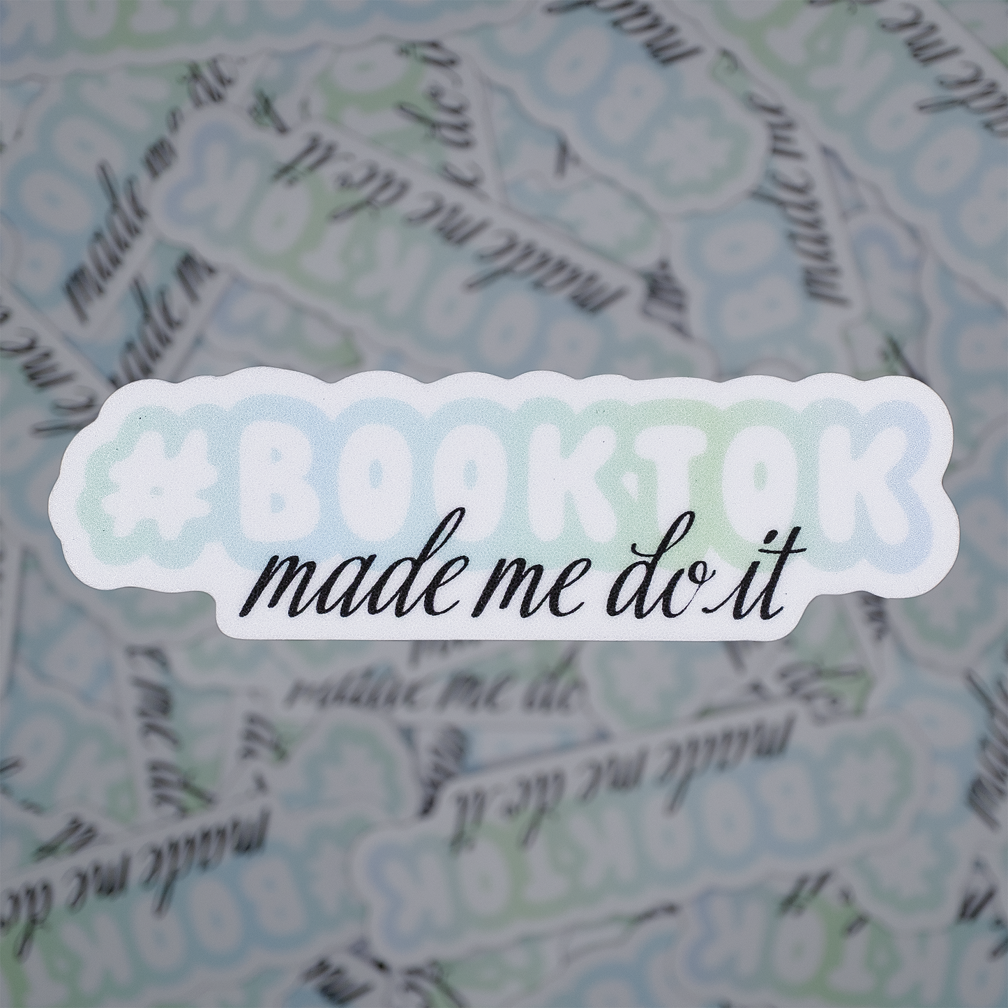 Sticker with 'Baking made me do it' text on a patterned background