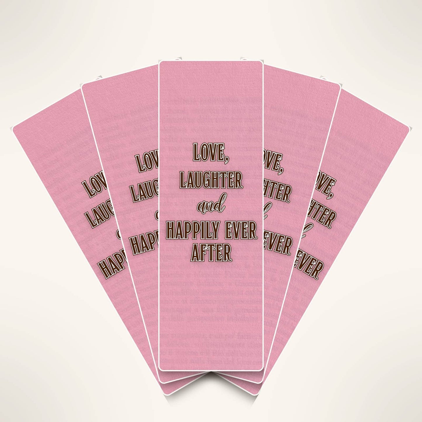 Stack of pink cards with text 'Love, Laughter and Happily Ever After' on a white background