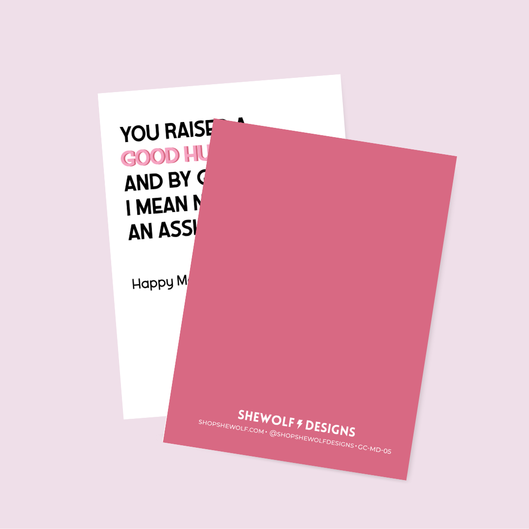 Pink card with text and Shewolf Designs branding on a light pink background