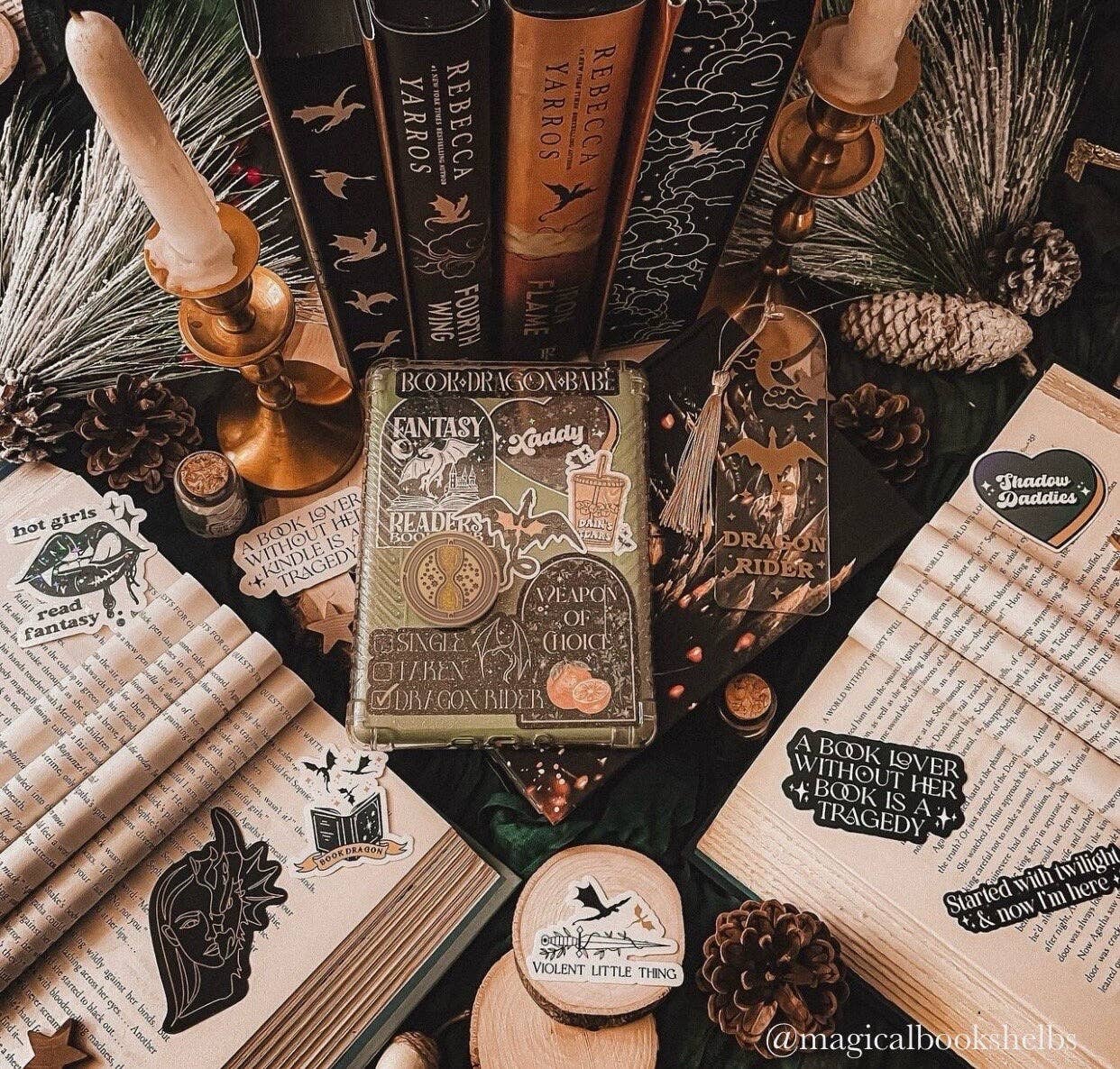 Decorative setup with books, candles, and decorative items on a table.