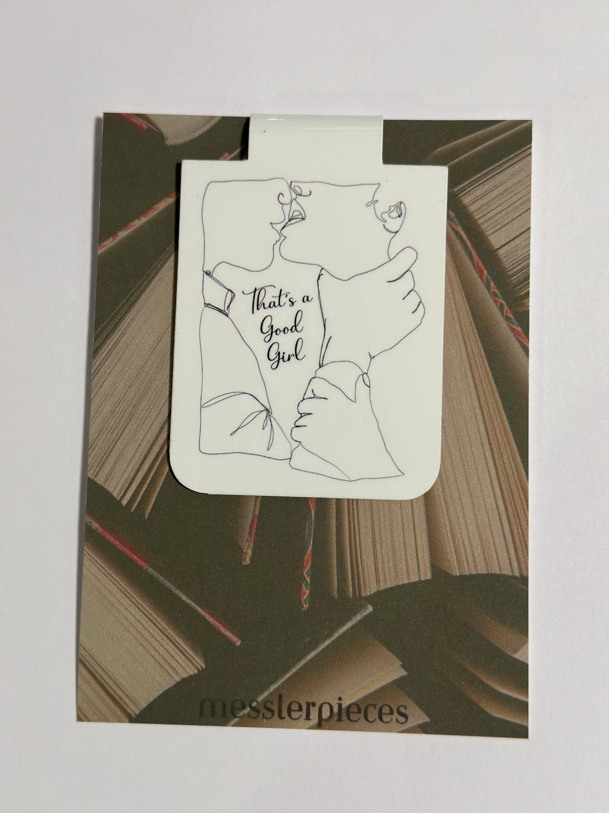 Book with a illustration of two hands holding a baby and text 'That's a Good Girl' on a white background.