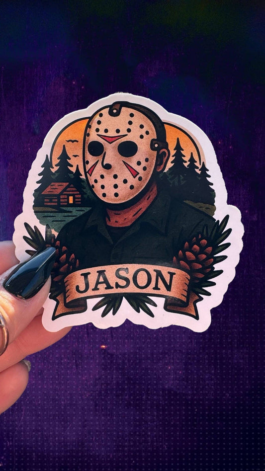 A die-cut sticker featuring a horror character in a hockey mask with pinecones and the name 'JASON' on a banner, held by a hand against a dark purple background.
