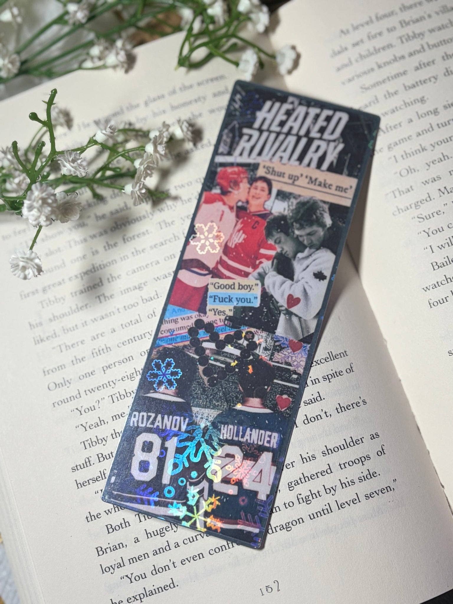 Bookmarks with images and text on a book page with flowers.