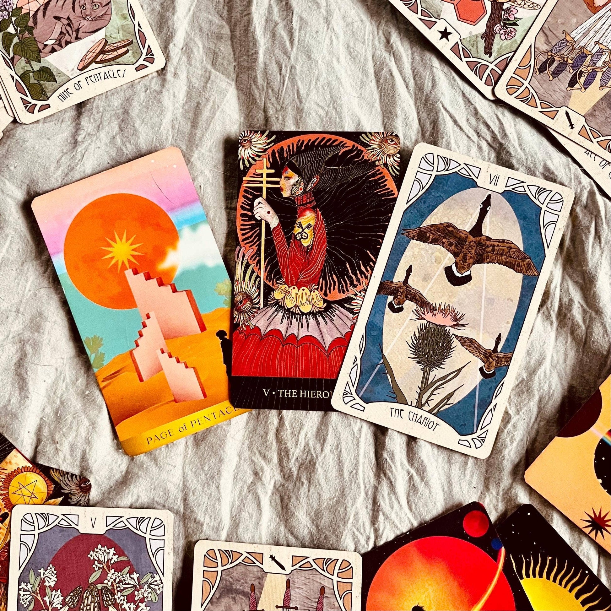 Collection of tarot cards on a textured surface