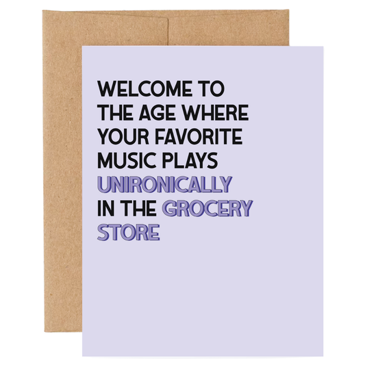 Greeting card with humorous text about music playing in the grocery store on a white background.
