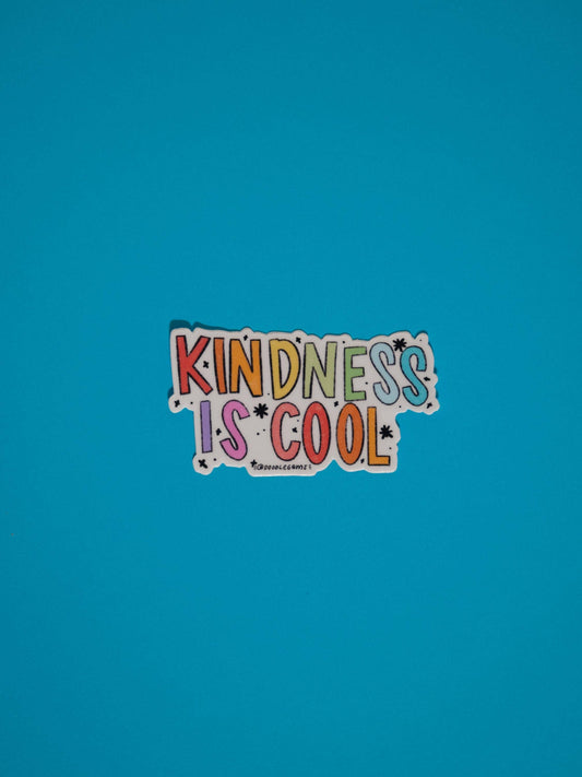 Colorful sticker with 'Kindness is Cool' text on a blue background
