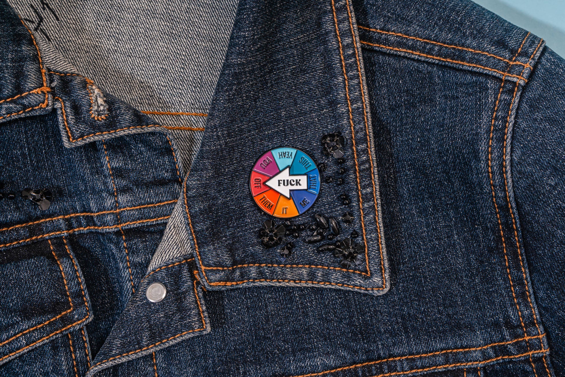 Colorful pin on a denim jacket