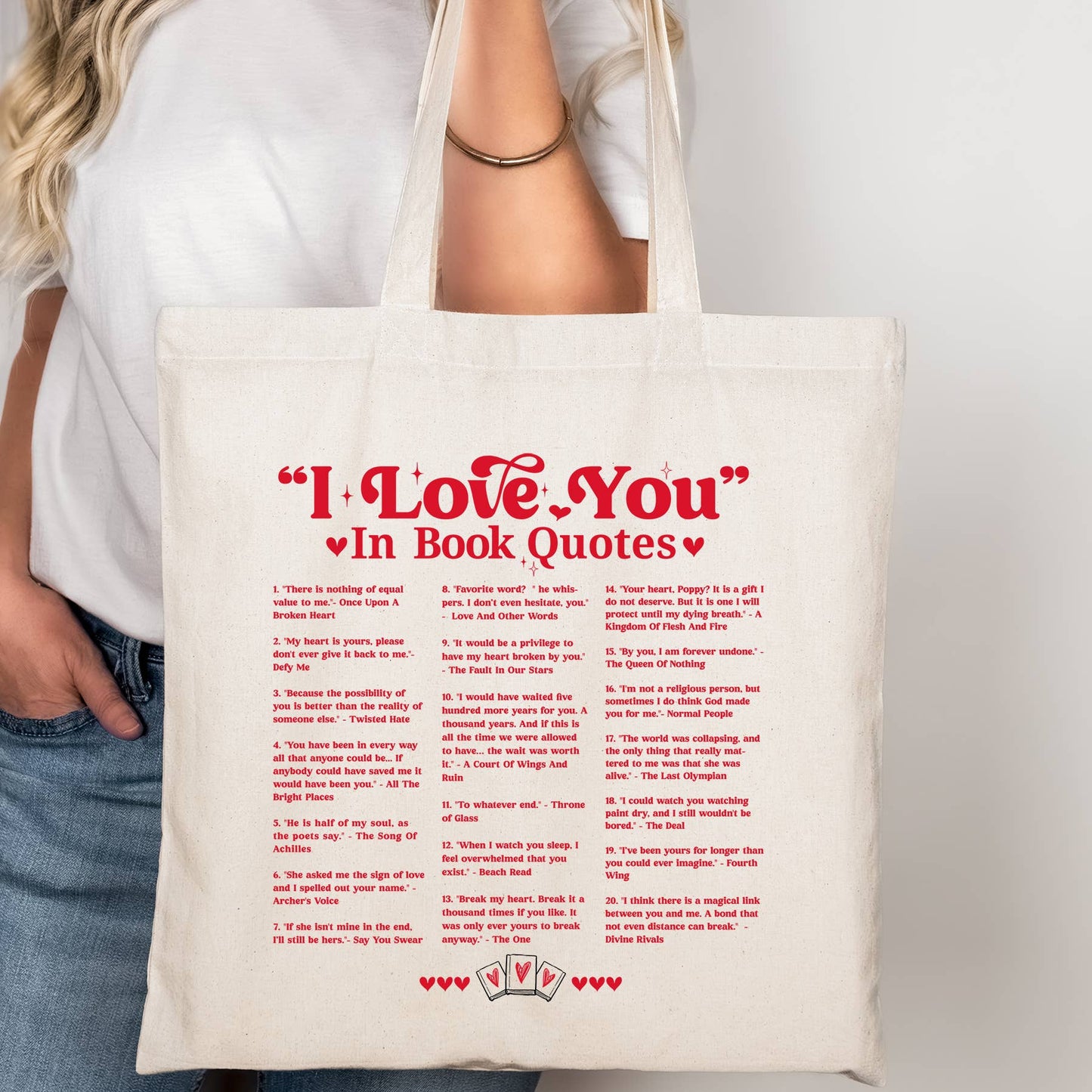 Tote bag with 'I Love You' in book quotes printed on it, held by a person.