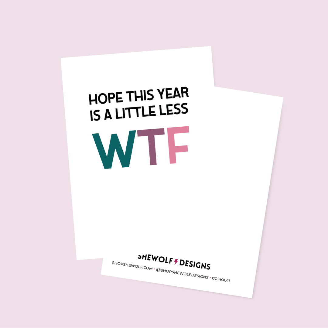 Card with text 'Hope this year is a little less WTF' by Shewolf Designs on a light pink background