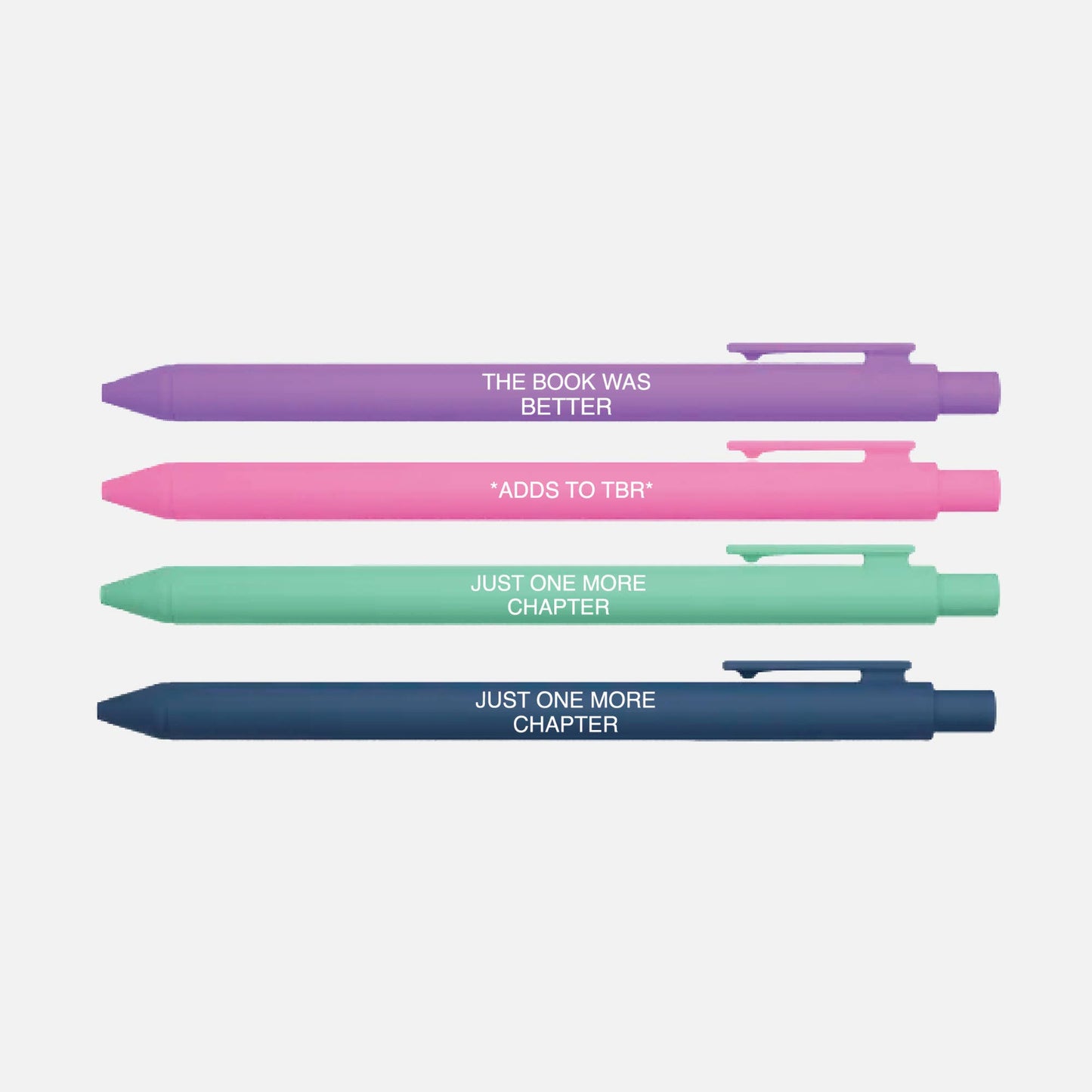 Four pens in different colors with book-themed text on a light gray background