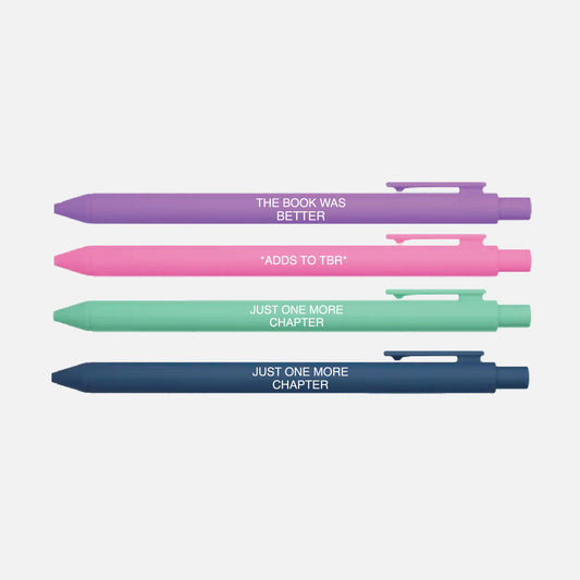 Four pens in different colors with book-themed text on a light gray background