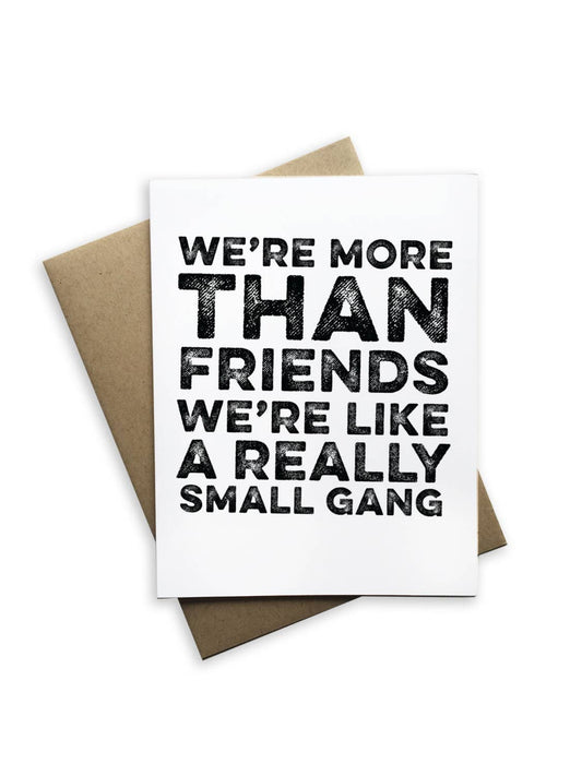 Greeting card with text 'We're more than friends, we're like a really small gang' on a white background.