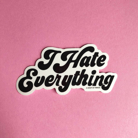Sticker with 'I Hate Everything' text on a pink background