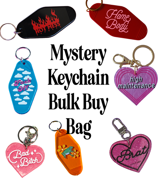 Collection of colorful keychains with various designs and text on a white background.