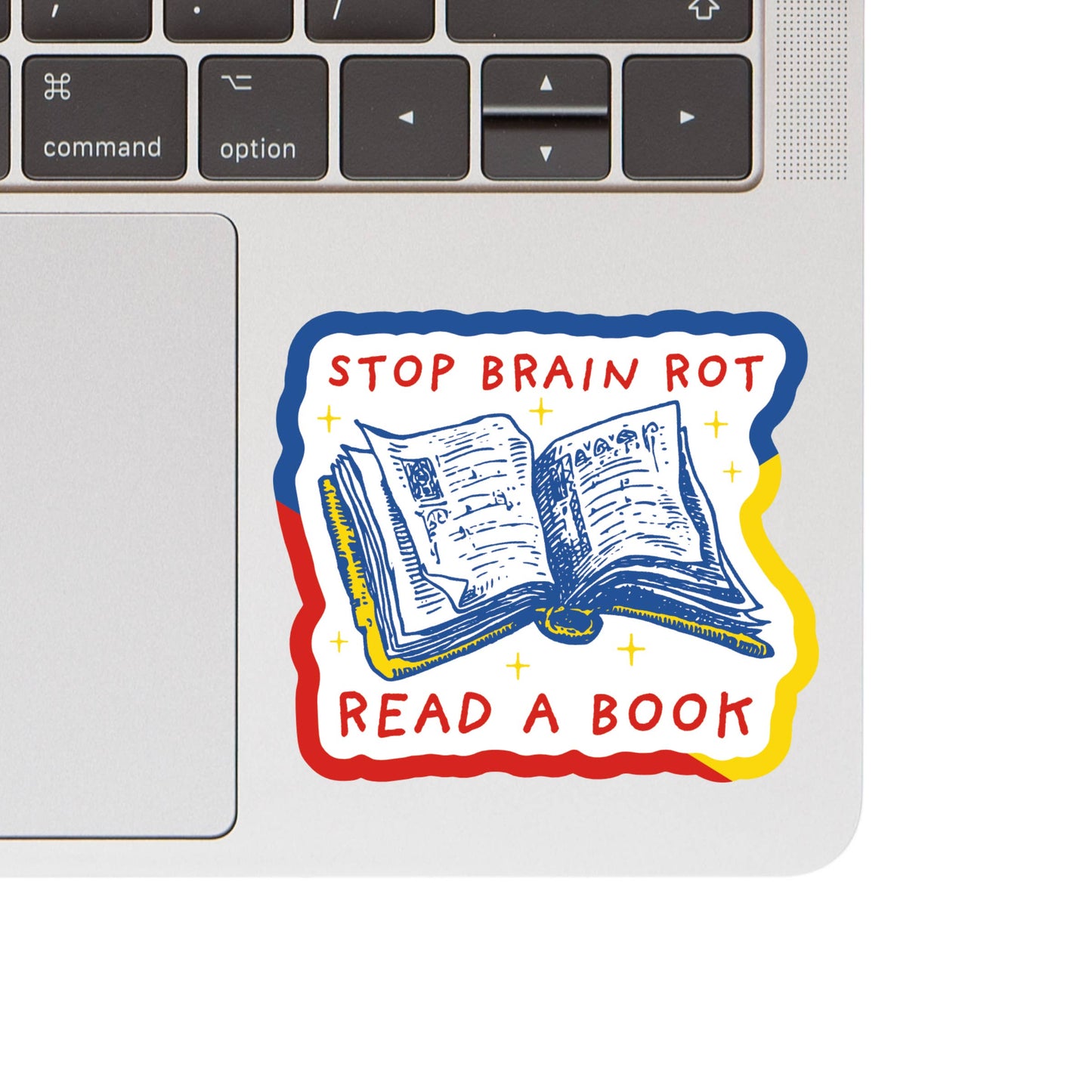 Laptop with a sticker that says 'Stop Brain Rot, Read a Book' on a white background