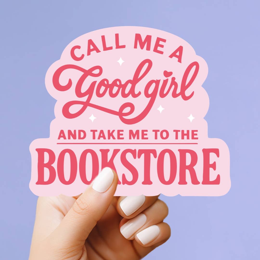 Hand holding a pink sign with text 'Call me a good girl and take me to the bookstore' against a purple background