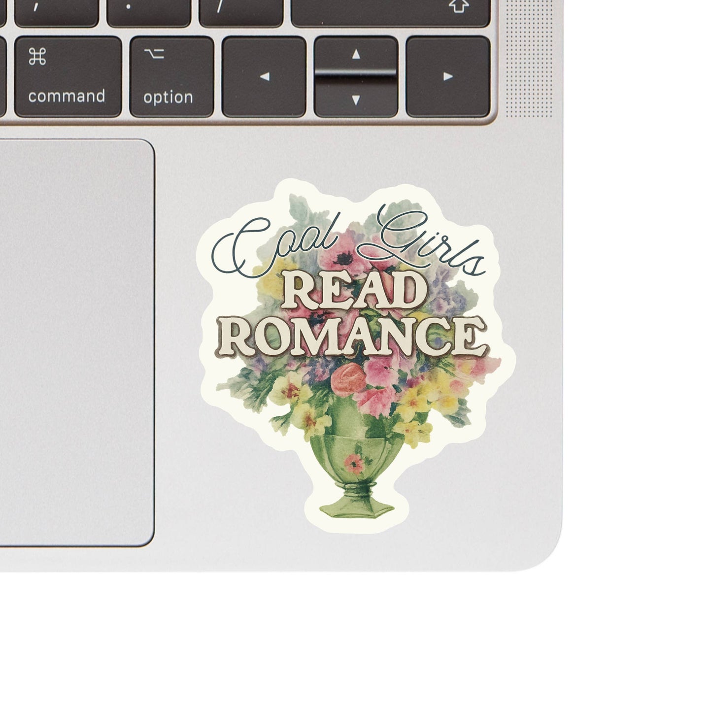 Sticker with 'Cool Girls Read Romance' text on a laptop