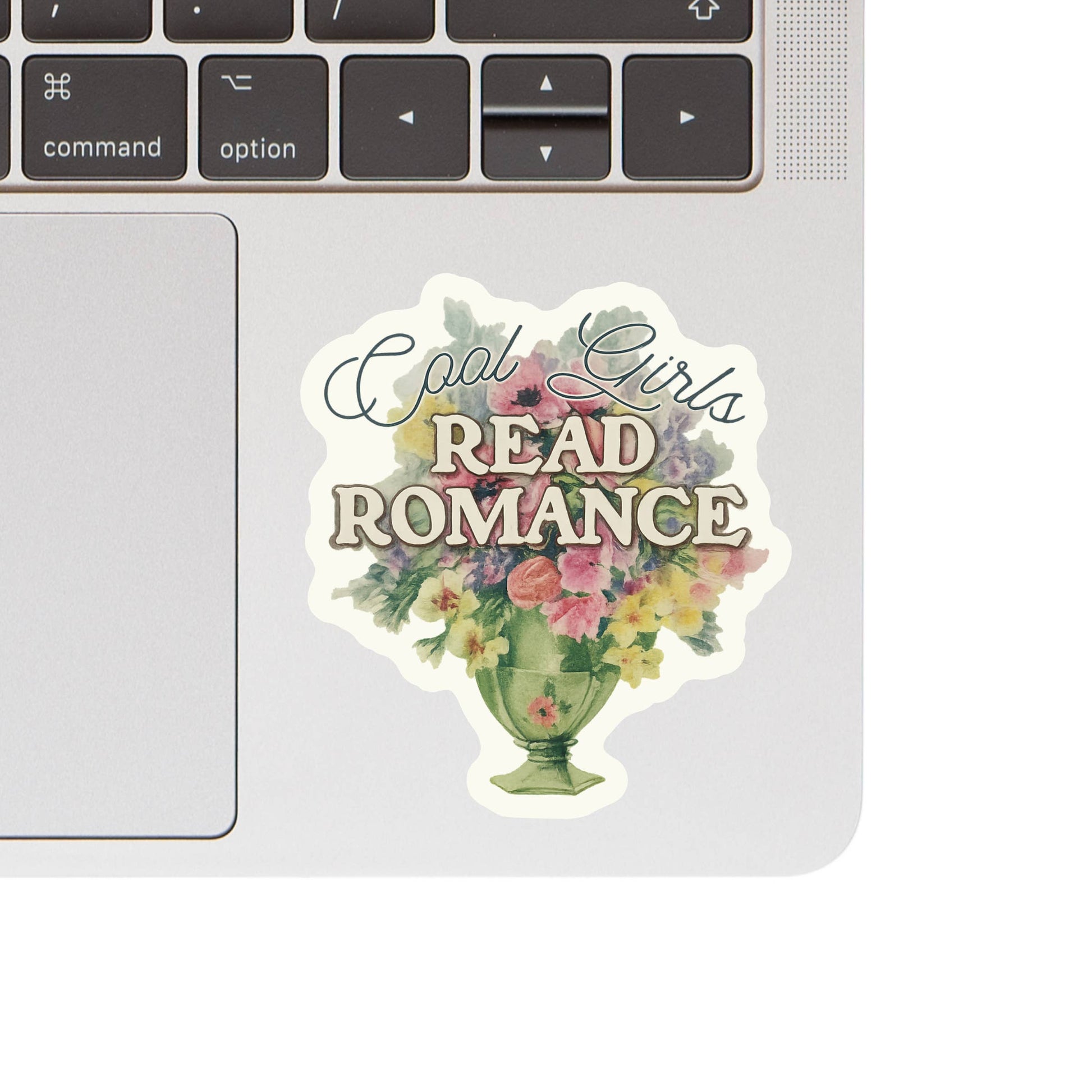 Sticker with 'Cool Girls Read Romance' text on a laptop