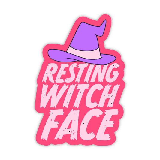 A die-cut sticker featuring a cartoon purple witch hat above the words 'RESTING WITCH FACE' in white distressed lettering on a bright pink background, shown on a plain white background.