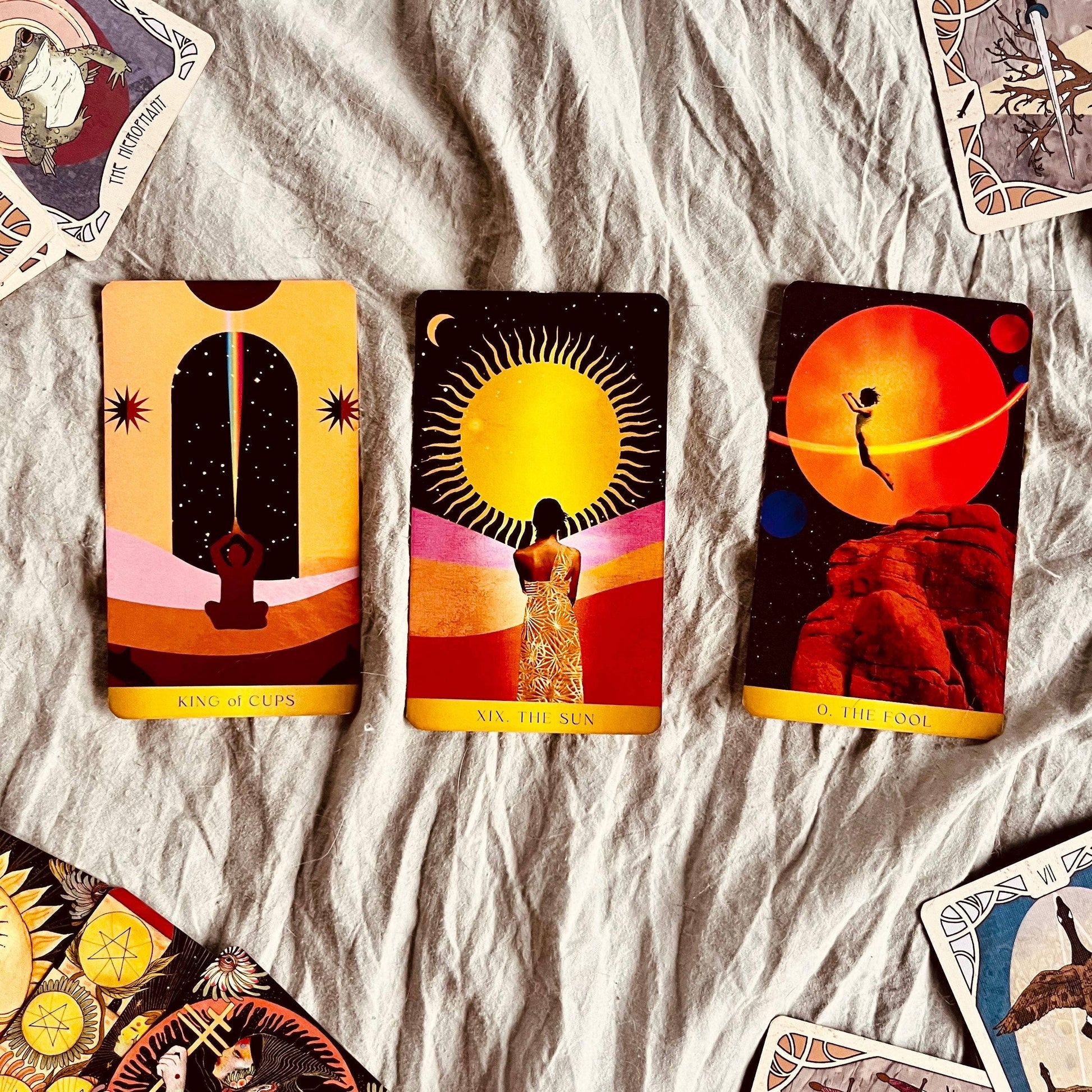 Collection of tarot cards on a textured surface