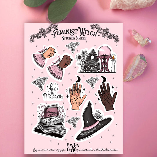 A pink sticker sheet titled 'Feminist Witch Sticker Sheet' featuring illustrated stickers of a hex code palmistry hand, a crystal ball, a pentacle, a witch hat, books, and text like 'Hex the Patriarchy'. The sheet is displayed on a pink background with decorative crystals and green leaves.