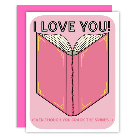 Card with an open book illustration and text 'I LOVE YOU! EVEN THOUGH YOU CRACK THE SPINES...' on a pink background.
