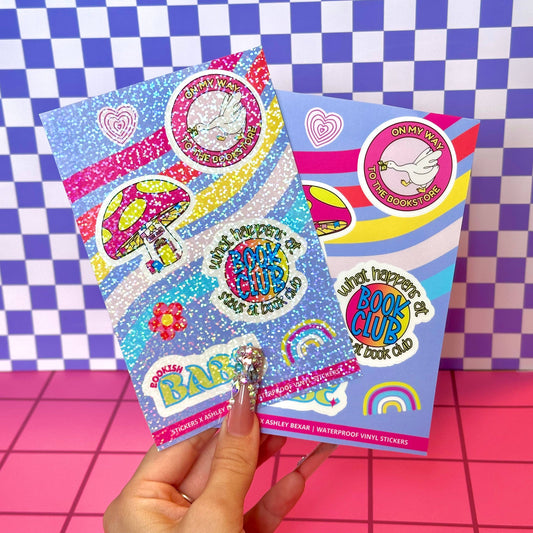 Colorful sticker booklets with various designs on a checkered background