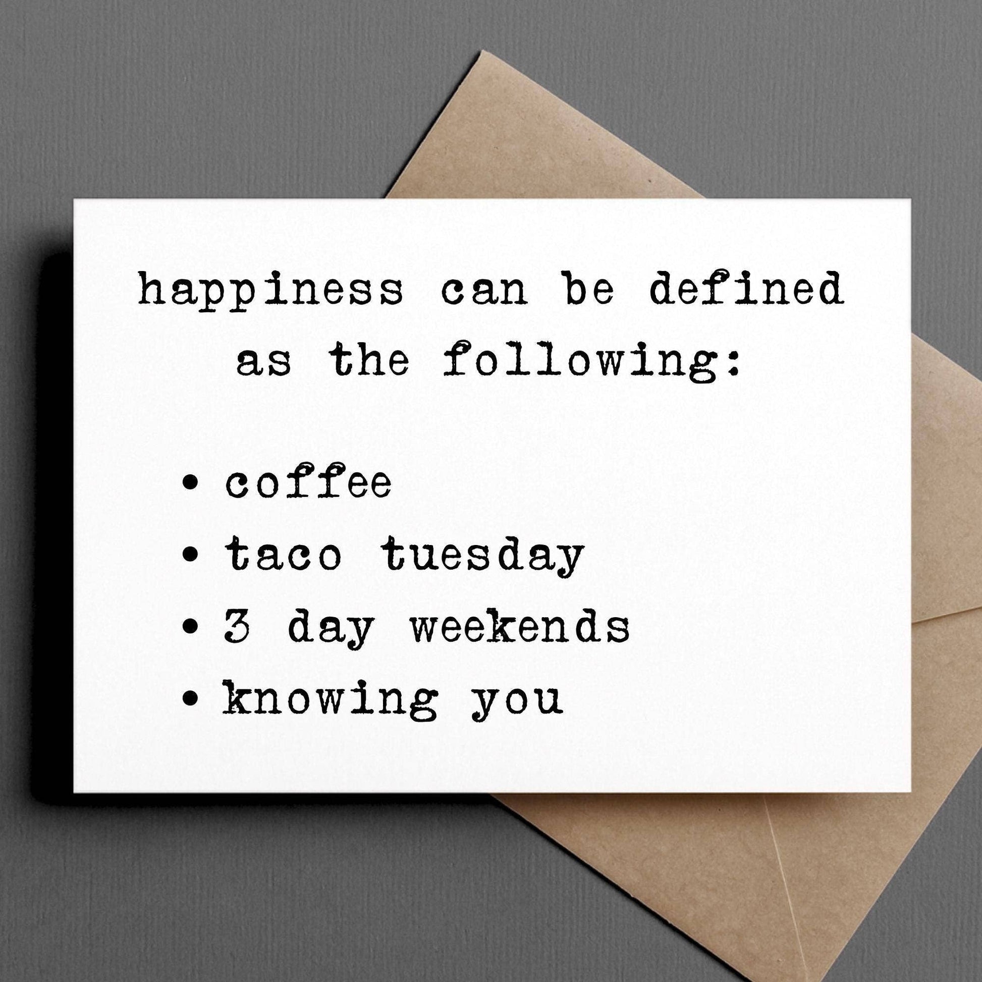 Card with text 'happiness can be defined as the following:' with a brown envelope on a gray background