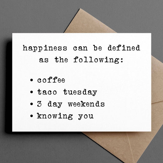 Card with text 'happiness can be defined as the following:' with a brown envelope on a gray background