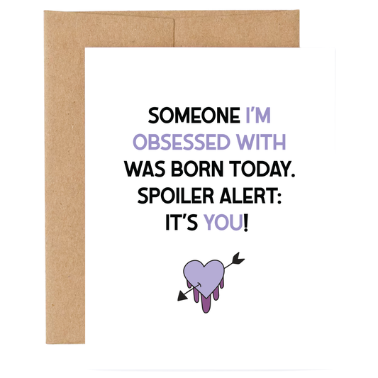 Card with text 'Someone I'm obsessed with was born today. Spoiler alert: It's you!' and a heart with an arrow through it on a white background.