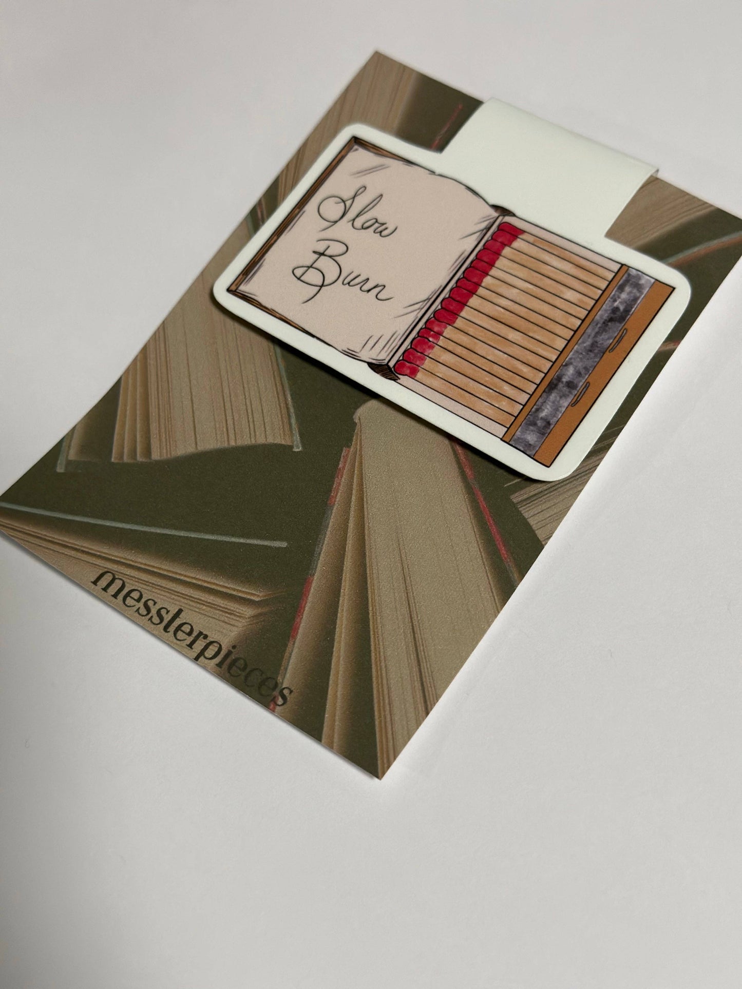Card with 'Slow Burn' text on a book-themed background