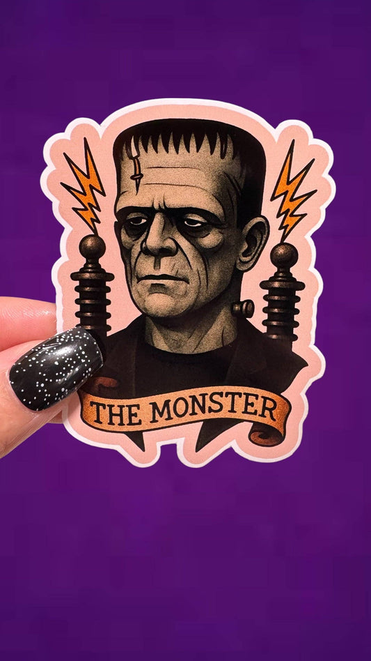 Sticker of a monster character with 'The Monster' text on a purple background