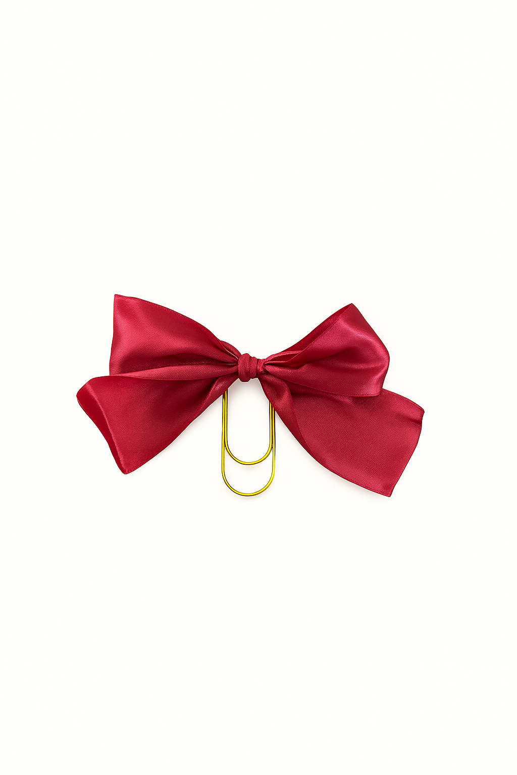 Red bow with a gold clip on a white background