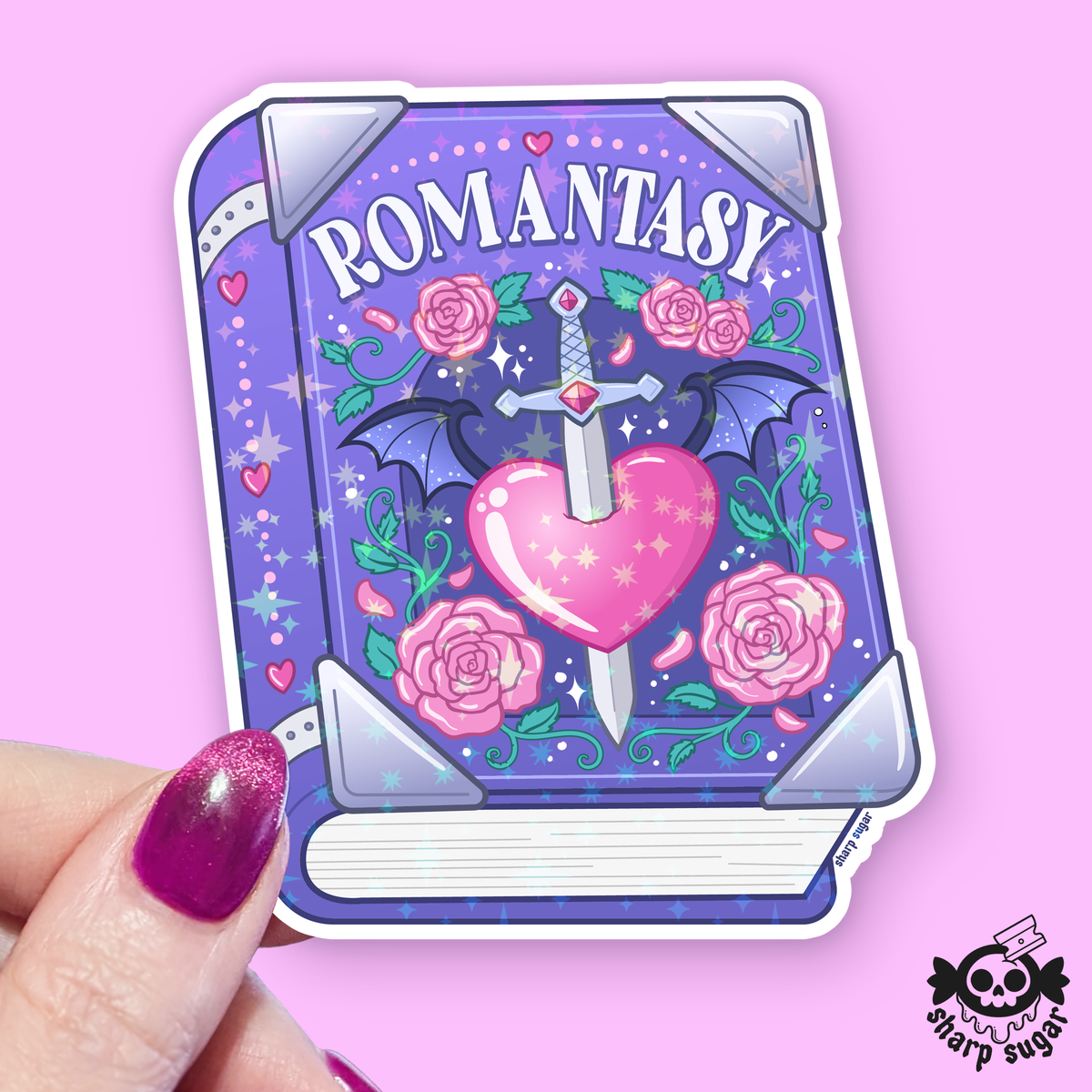Illustrated card with 'ROMANTASY' text, heart, sword, and roses on a pink background.