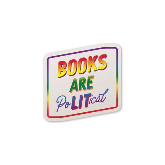 A die-cut sticker with the text 'BOOKS ARE POLITICAL' in rainbow-colored lettering on a white background, shown on a clean white studio backdrop.