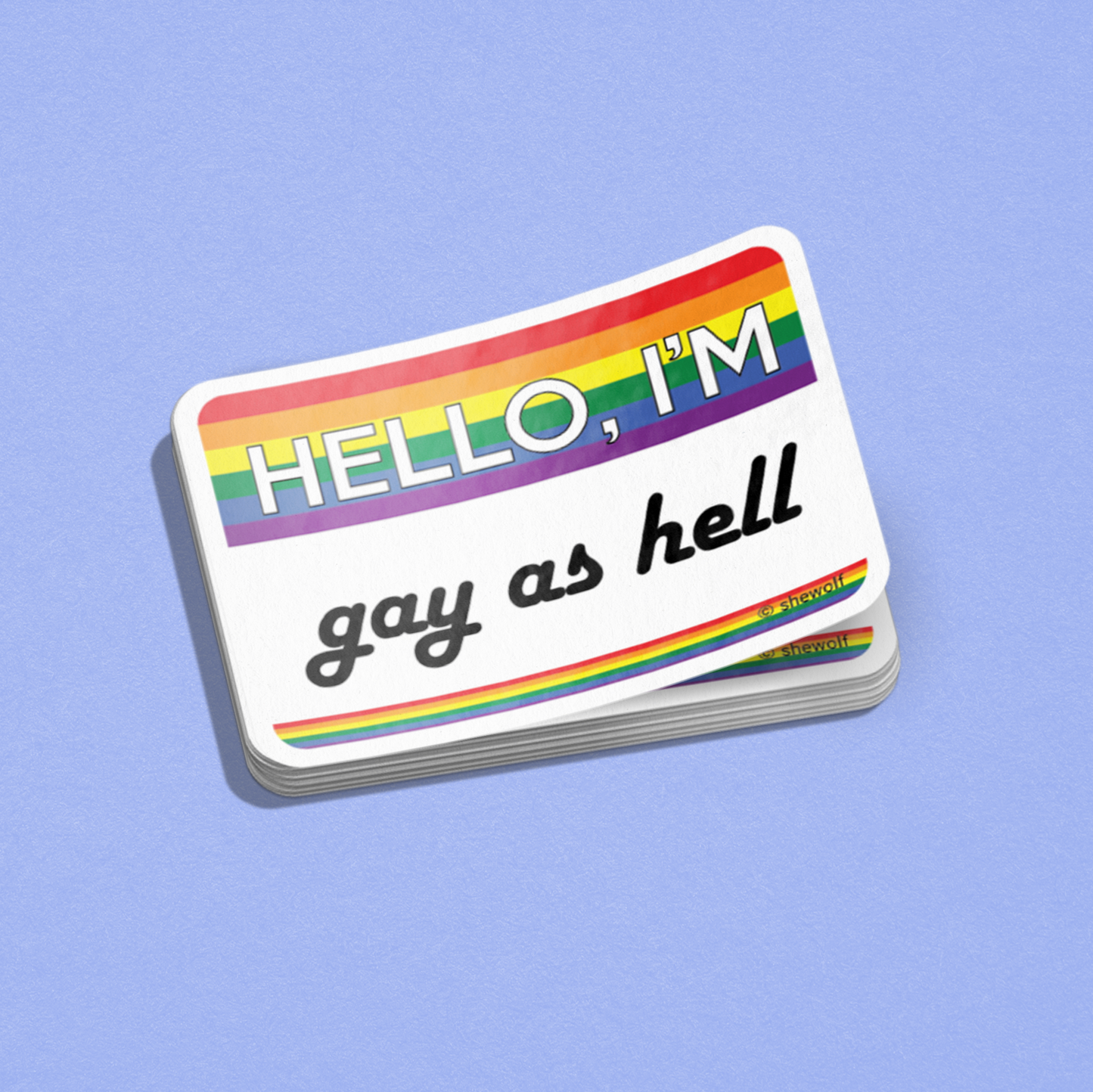 Sticker with rainbow border and text 'HELLO, I'M gay as hell' on a light blue background