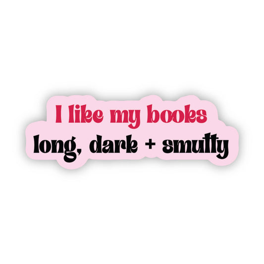 Pink sticker with text 'I like my books long, dark + smutty' on a white background