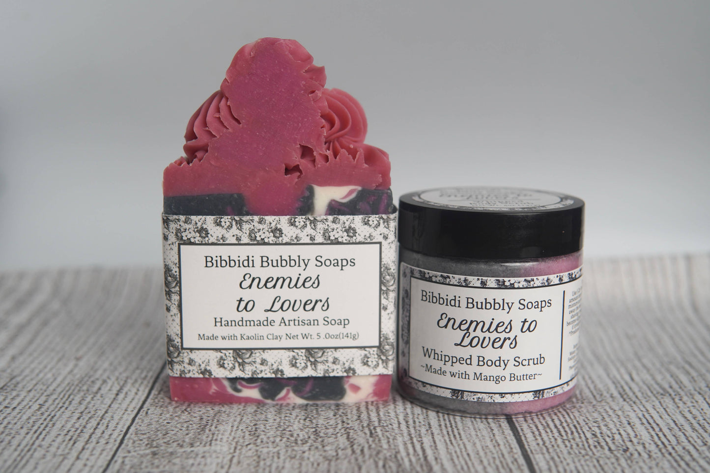 Two handmade soap products from Bibbidi Bubbly Soaps on a wooden surface.