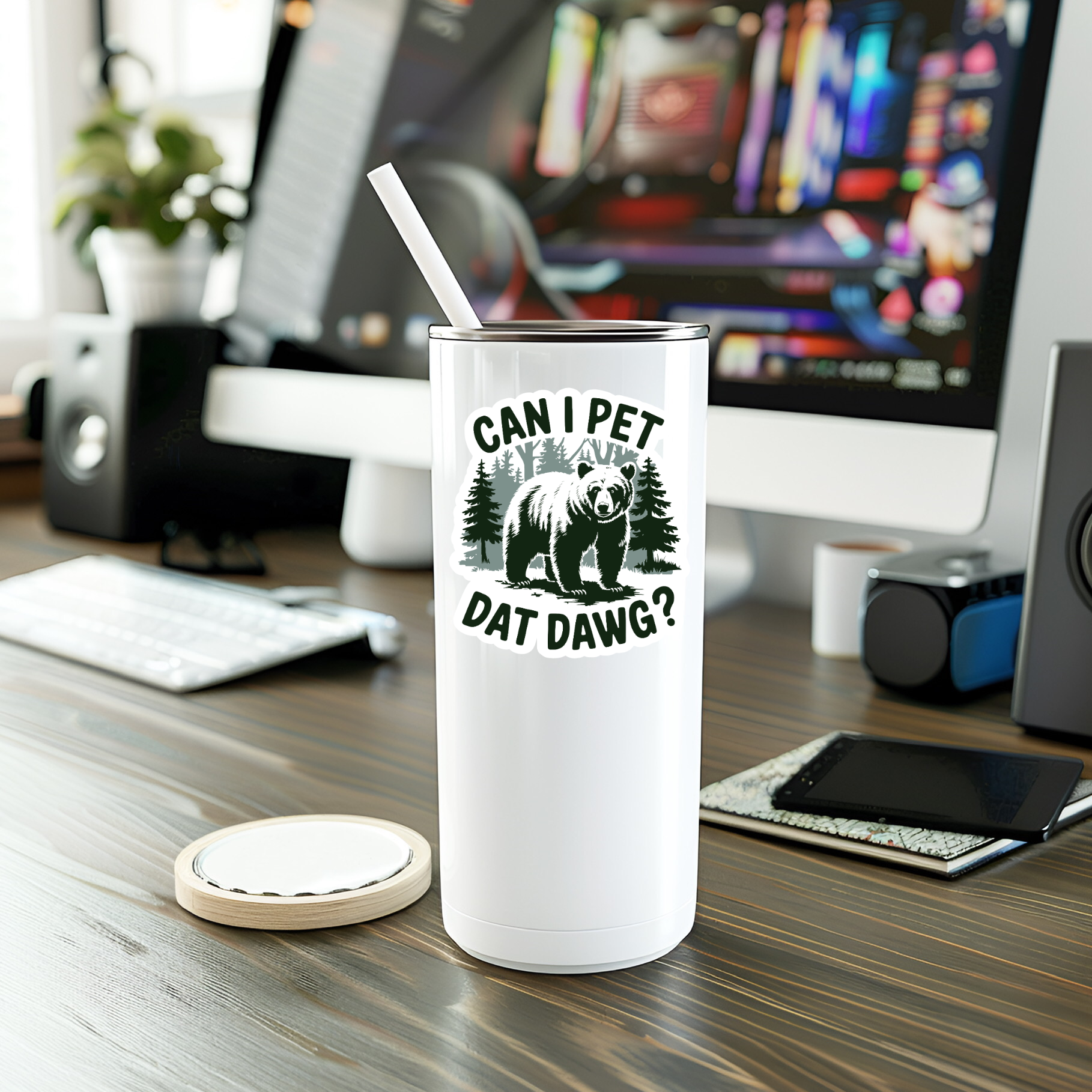 White tumbler with bear graphic and text on a desk with computer setup