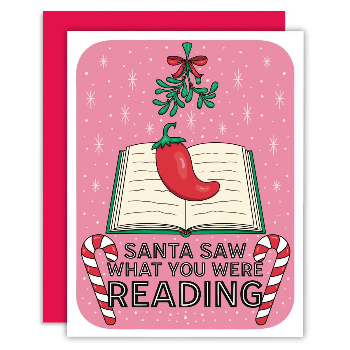 A Christmas-themed greeting card with a pink background and red envelope. The card features an illustration of an open book with a red chili pepper on it, mistletoe, candy canes, and the text 'SANTA SAW WHAT YOU WERE READING'.