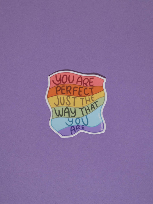 Rainbow sticker with You are perfect just the way that you are on a purple background