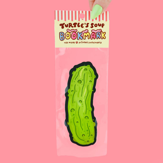 Bookmark shaped like a pickle with 'Turtle's Soup' branding on a pink background