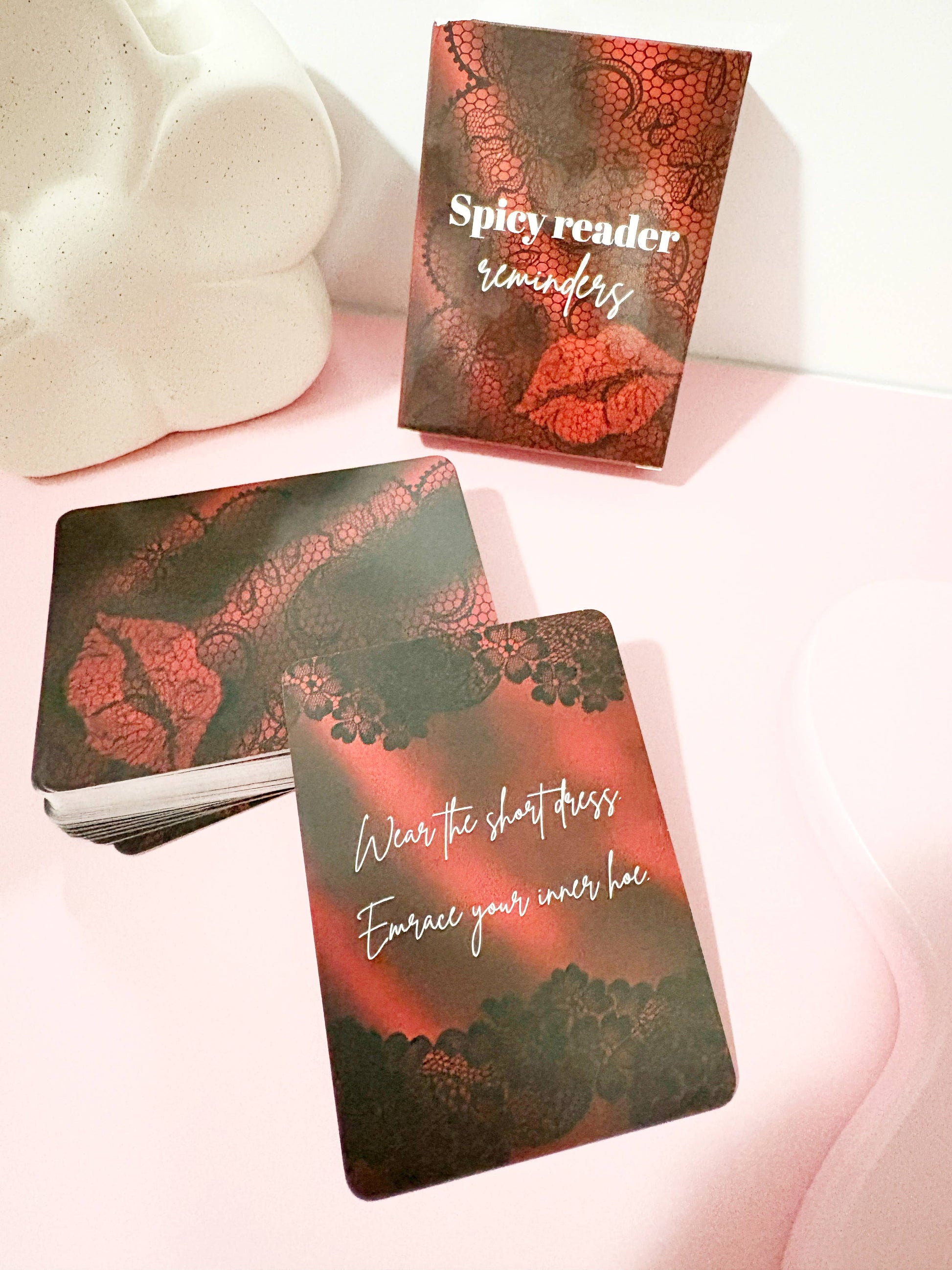 Spicy Reader reminders cards with red and black design on a white surface