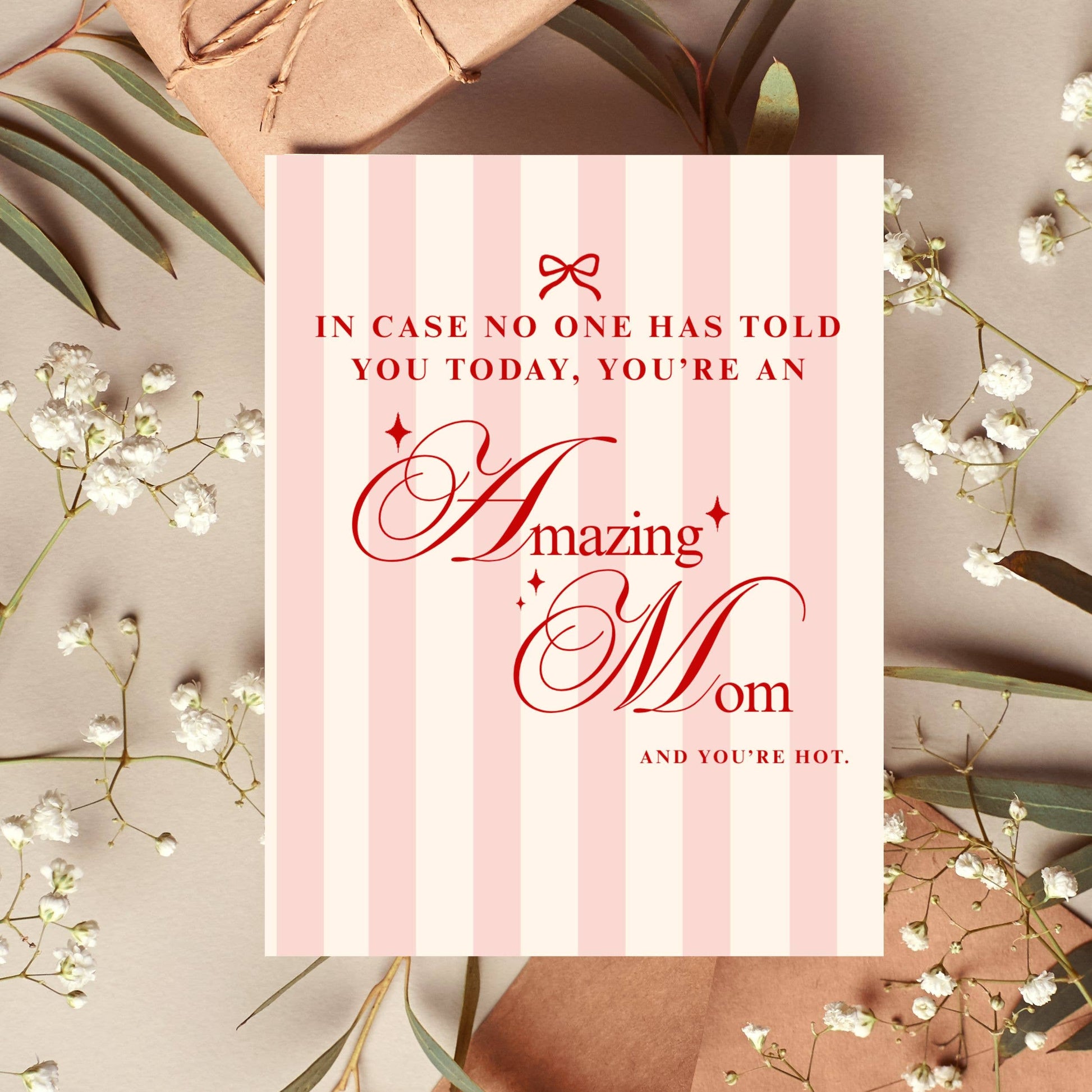 Greeting card with text 'In case no one has told you today, you're an amazing mom and you're hot.' on a pink striped background with flowers.
