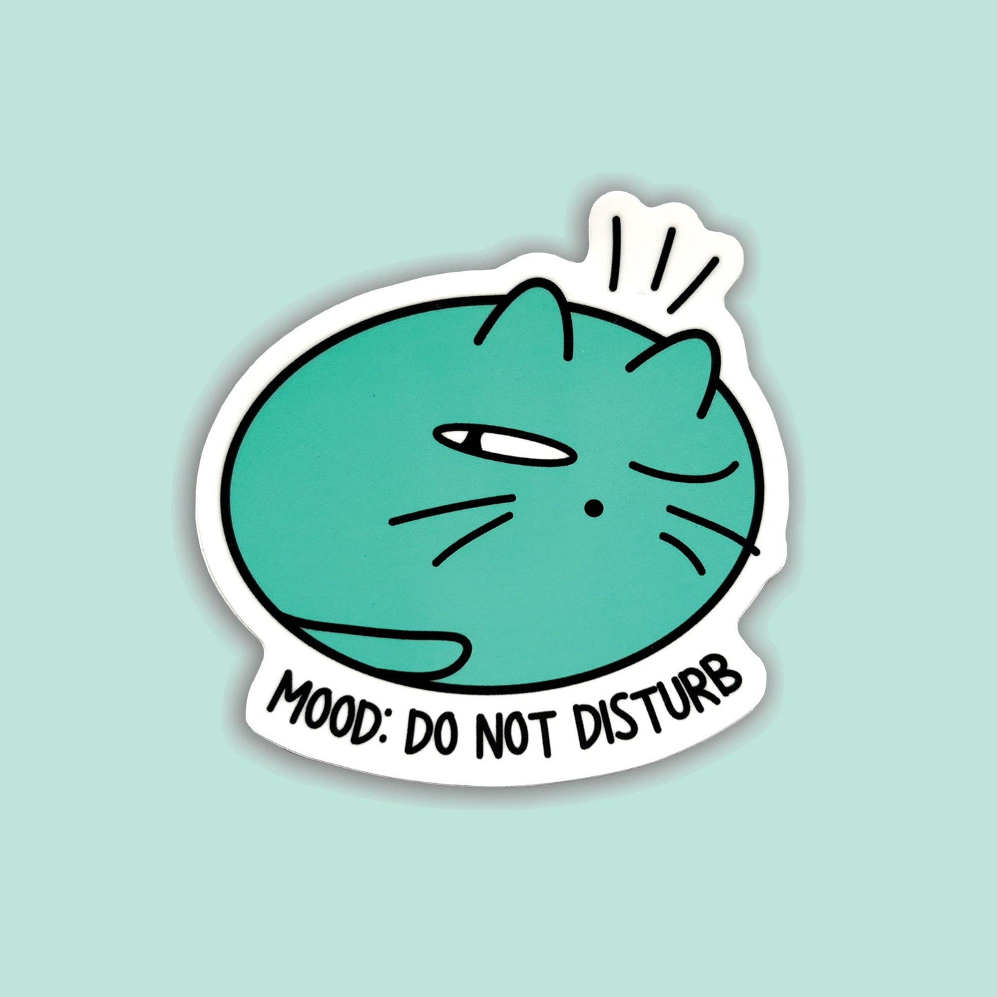 A die-cut sticker featuring a teal cartoon cat with one eye closed and the text 'MOOD: DO NOT DISTURB' on a light mint background.