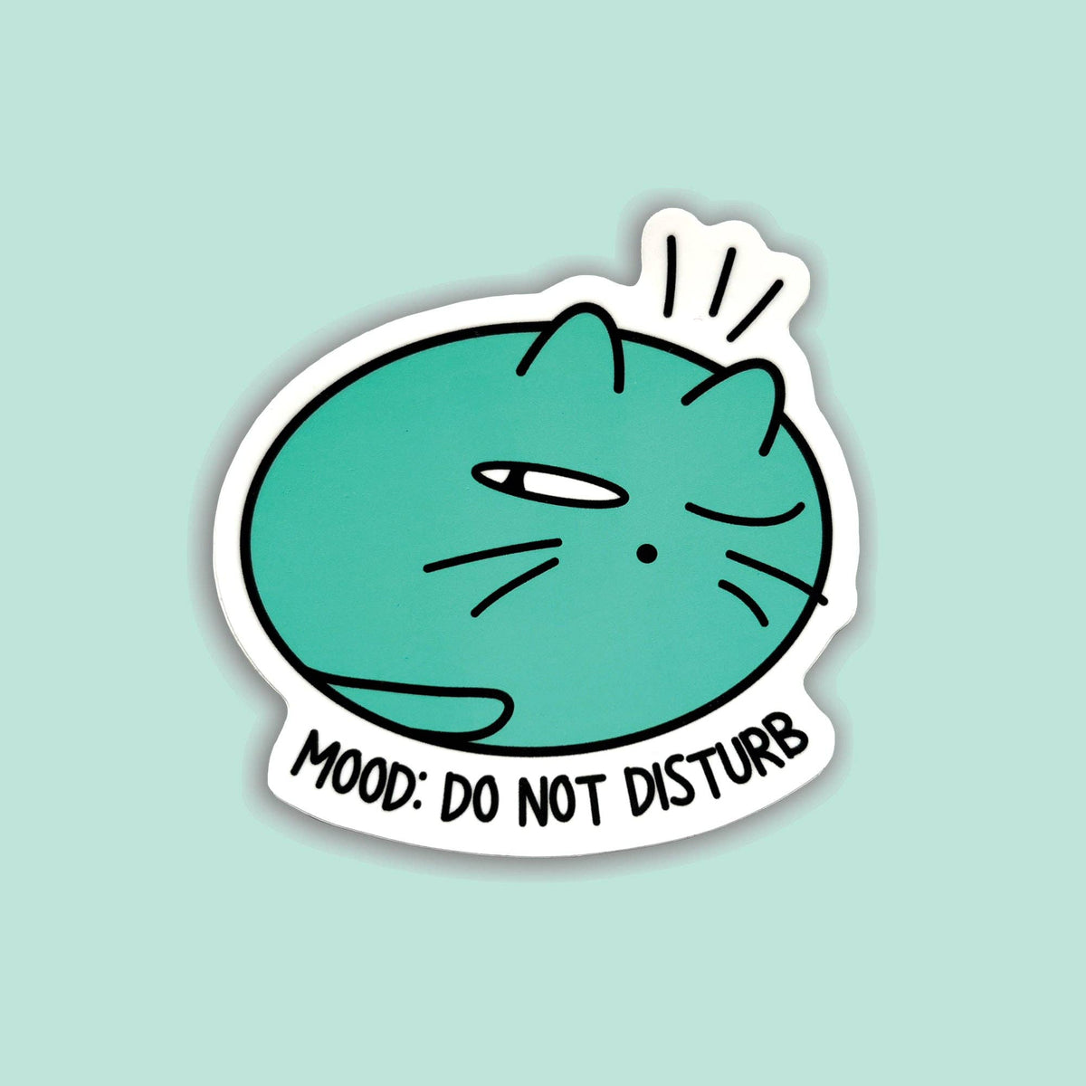 A die-cut sticker featuring a teal cartoon cat with one eye closed and the text 'MOOD: DO NOT DISTURB' on a light mint background.